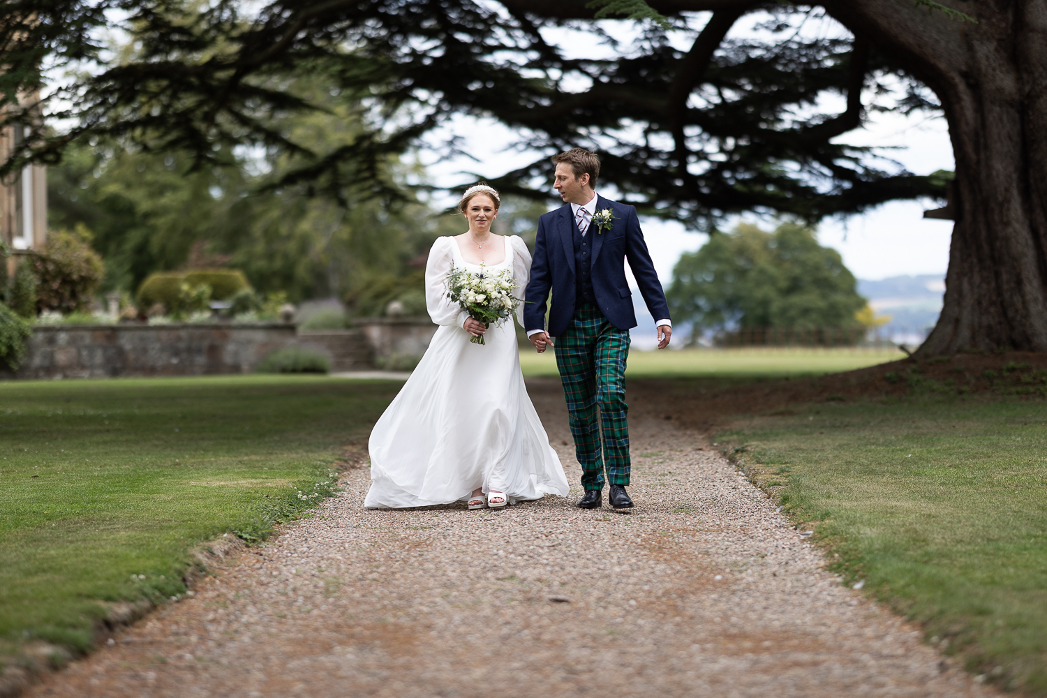 couple portrait walking in the grounds of errol park