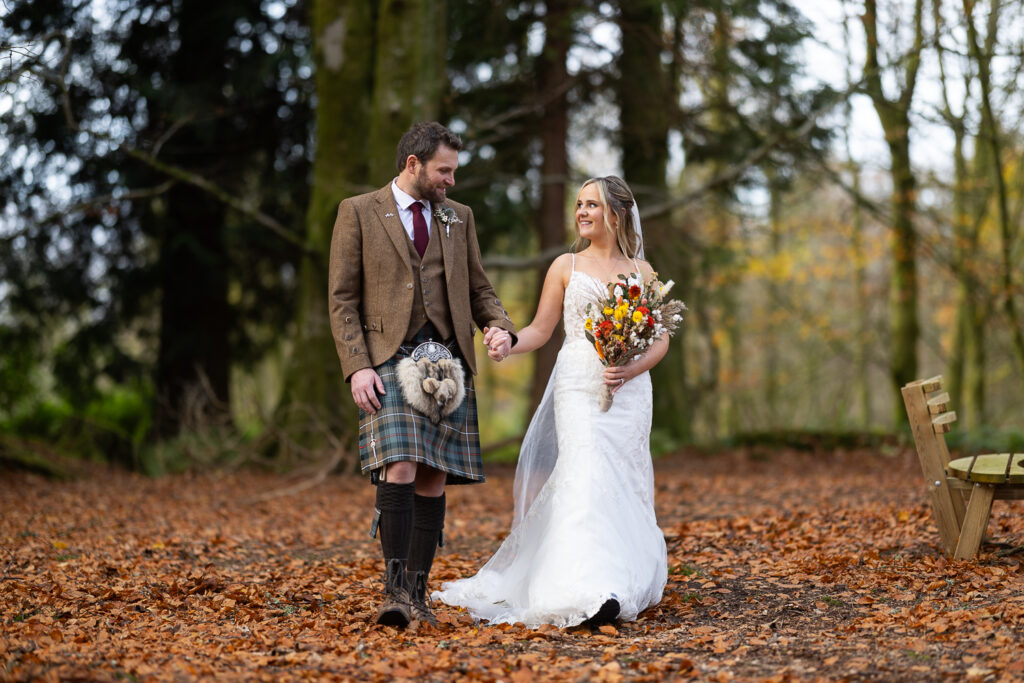 couple portrait walking in the woods