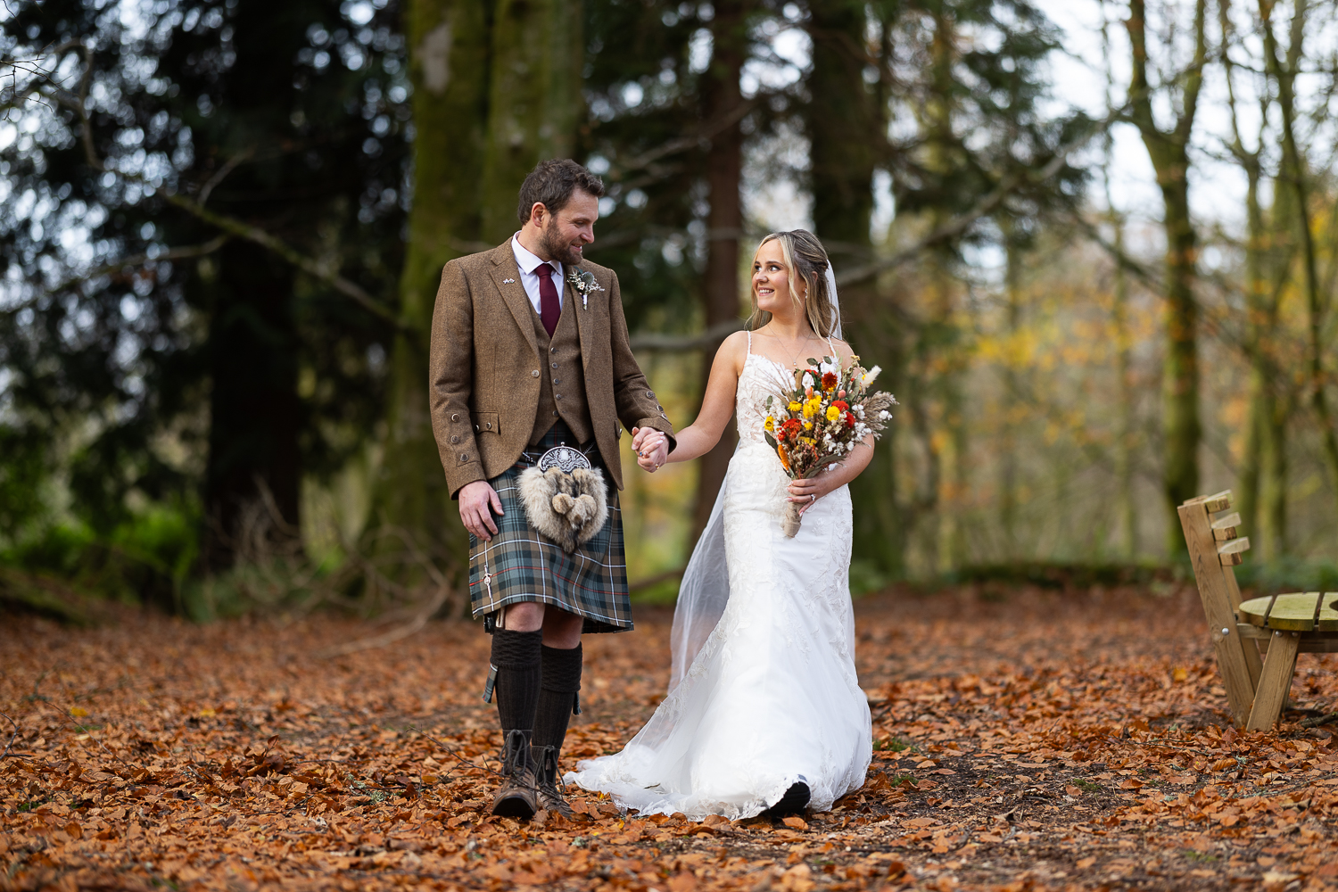 couple portrait walking in the woods
