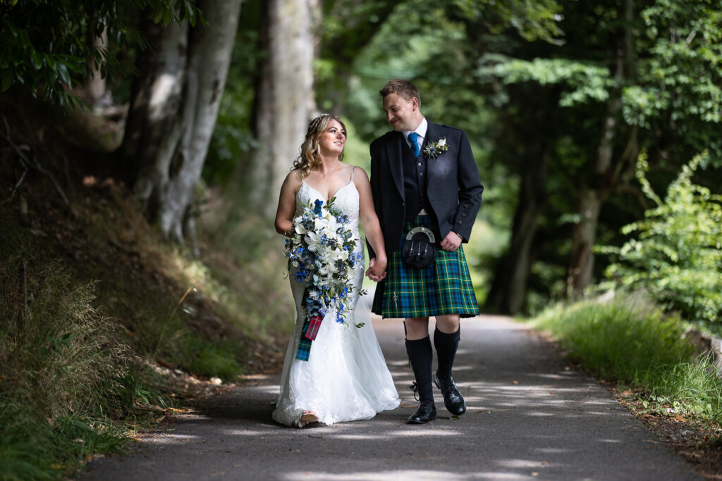 couple portrait walking in the woods