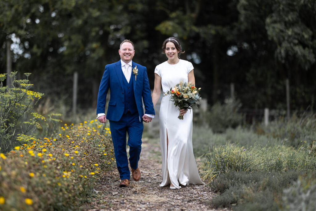 bride & groom portrait walking in the gardens